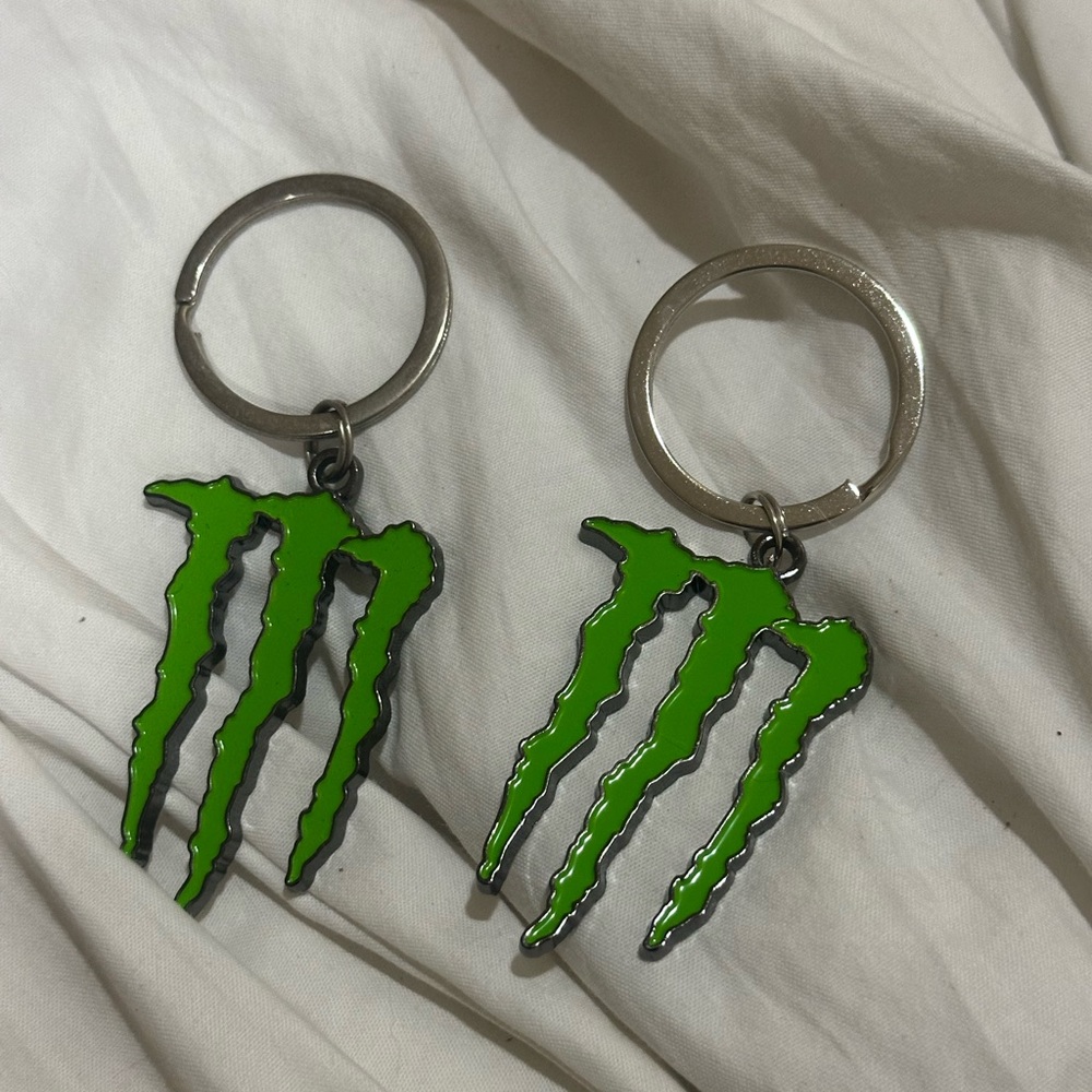 Two Monster energy key chains